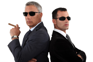 Powerful businessmen in sunglasses - obrazy, fototapety, plakaty