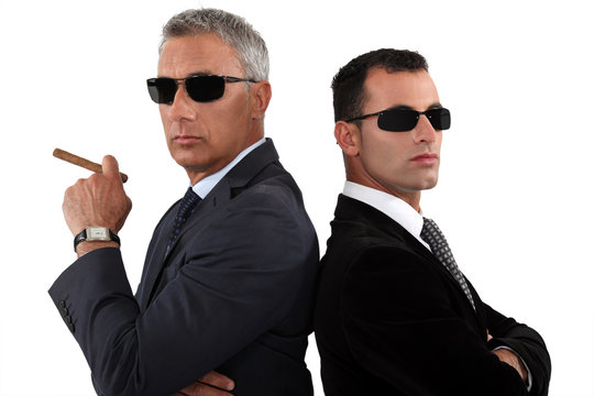 Powerful businessmen in sunglasses