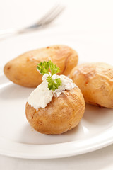 Baked potato filled with soft cheese
