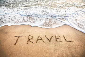 Travel word on the beach