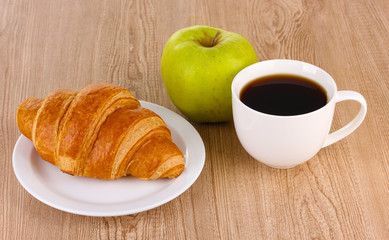 Classical breakfast. Coffee and croissant