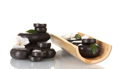 Composition of spa stones, bamboo, petals and leaves isolated