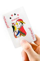 Hand holding a joker playing card