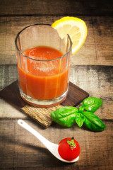 tomato drink with basil and lemon slice