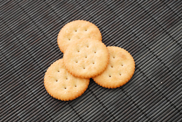 Crackers on Black Bamboo Surface