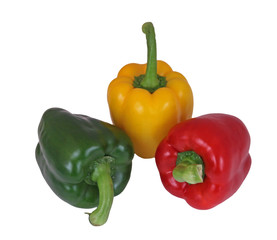 Red, green and yellow peppers on a plain white background.