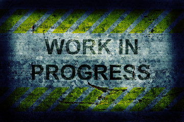 Grunge background with wotk in progress text