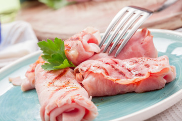 Grilled Ham rolls stuffed with cheese and parsley