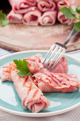 Grilled Ham rolls stuffed with cheese and parsley
