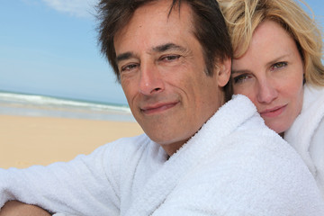 Couple with beach in background