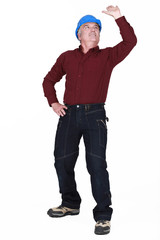 Builder reaching upwards