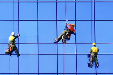 Three washers wash the windows