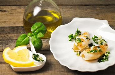 grilled squid with lemon slice and oil