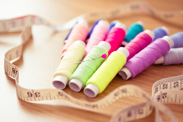 Fototapeta na wymiar set of pink colorful sewing threads
