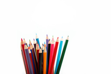 Close up of color pencils with different color over white backgr