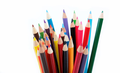 Fototapeta premium Close up of color pencils with different color over white backgr