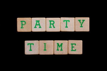 Party time spelled out in old wooden blocks