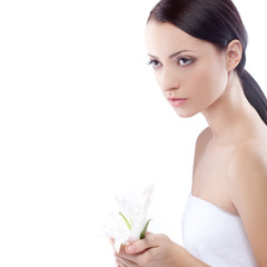 Fototapeta premium serioulsy woman holding lily flower