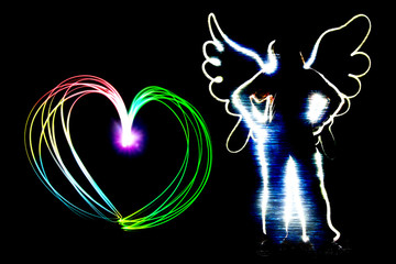 angel and heart shape drawing by flashlight multiple color in th