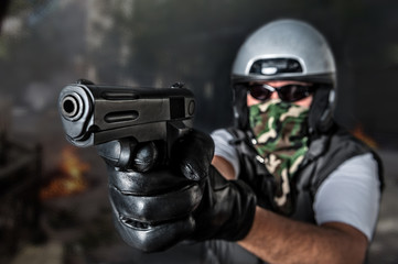 protester with gun during riots