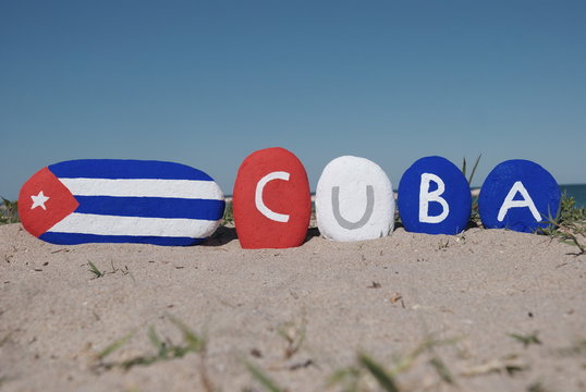 Cuba flag and name of the nation on pebbles