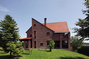 Fototapeta na wymiar modern bricks house, surrounded by nature