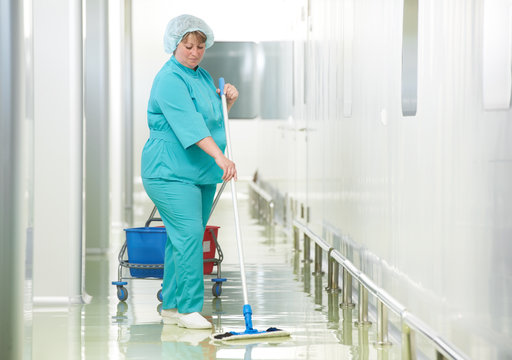 Woman cleaning hospital hall