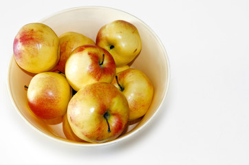 Naklejka na ściany i meble apples in a fruit basket isolated on white