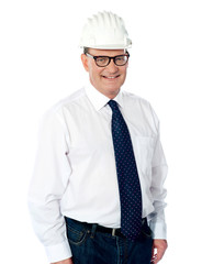 Handsome smiling aged engineer with hard hat