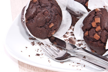Fresh chocolate muffins on a plate