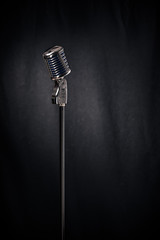 Microphone on stand in spotlight