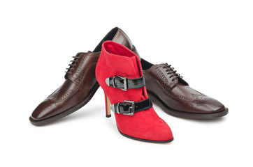 Male and female shoes on white