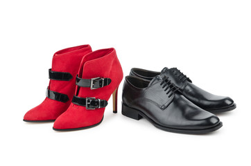 Male and female shoes on white