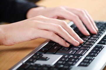 Hands typing on the keyboard