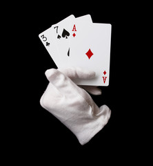 Cards in hand isolated on black