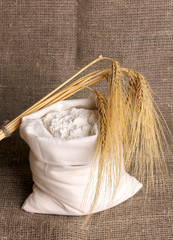 Flour and wheat grain on sackcloth