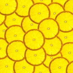 Fotobehang Plakjes fruit Achtergrond met citrusvruchten van stukjes sinaasappel / verlichte achtergrond