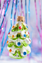 Christmas ornament shaped like a snow covered tree