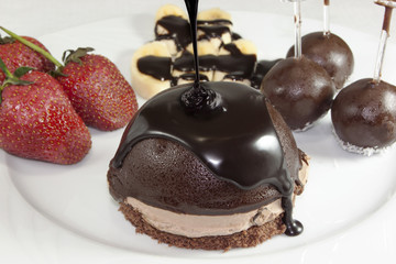 pouring chocolate on cake