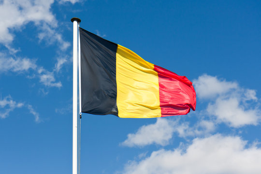Belgium flag over a blue sky