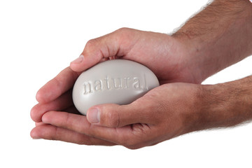 Man holding large pebble