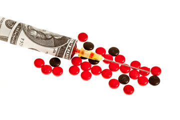 syringe dollar and pills on white background
