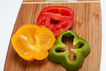 close up of red, yellow and green peppers