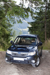 Subaru Forester on the off road track in mountains