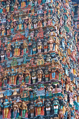 wall of colourful sculptures on Hindu temple, India