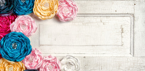 Multi colored vintage flowers on aged door