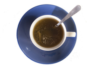 Cup of tea on blue saucer
