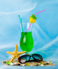 Exotic cocktail with tropical starfish and glasses