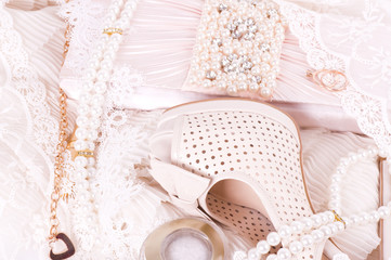 The beautiful bridal shoes, lace, bag and beads