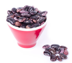 Color kidney beans in a bowl isolated on a white background
